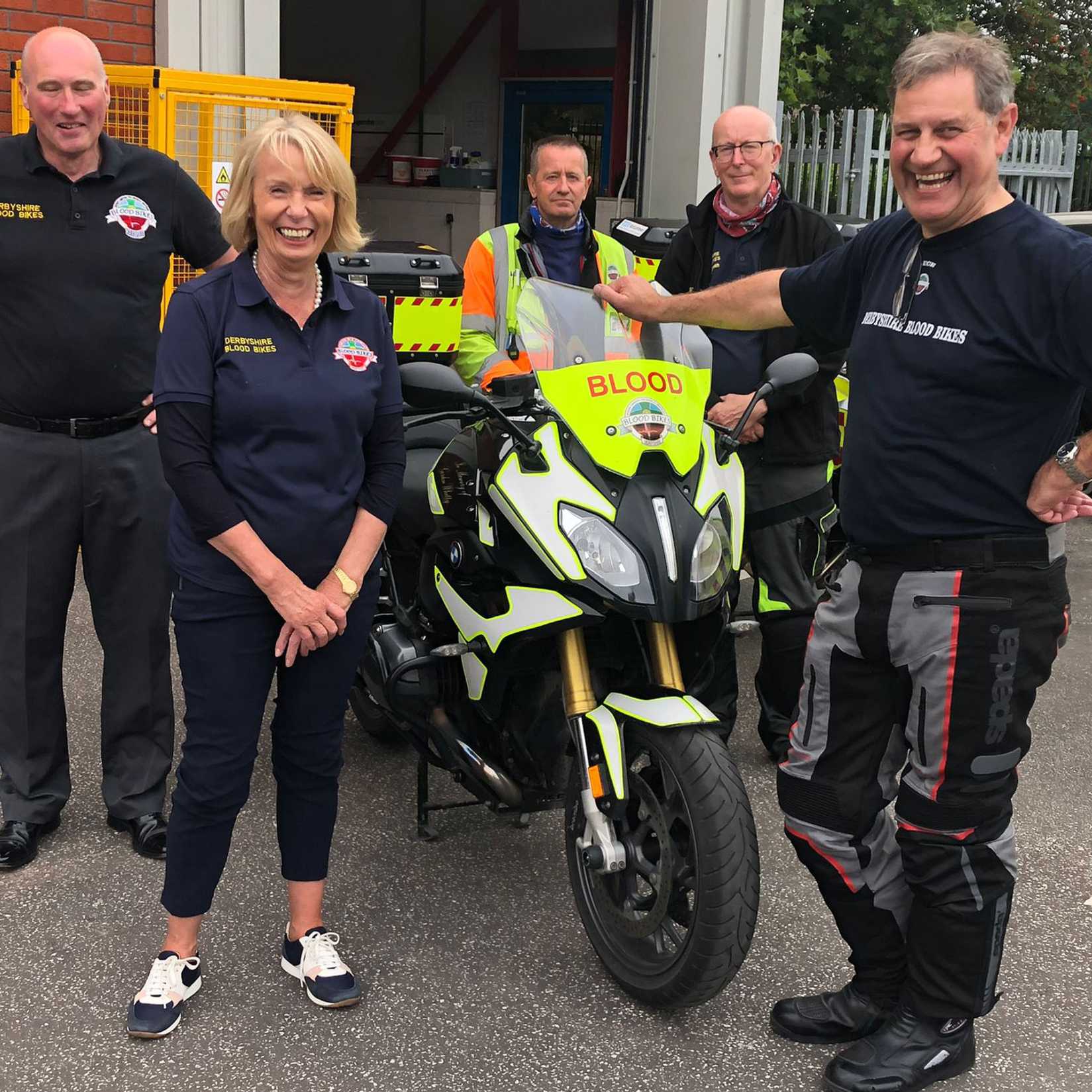 Blood Bike volunteers stod next to a Blood Bike