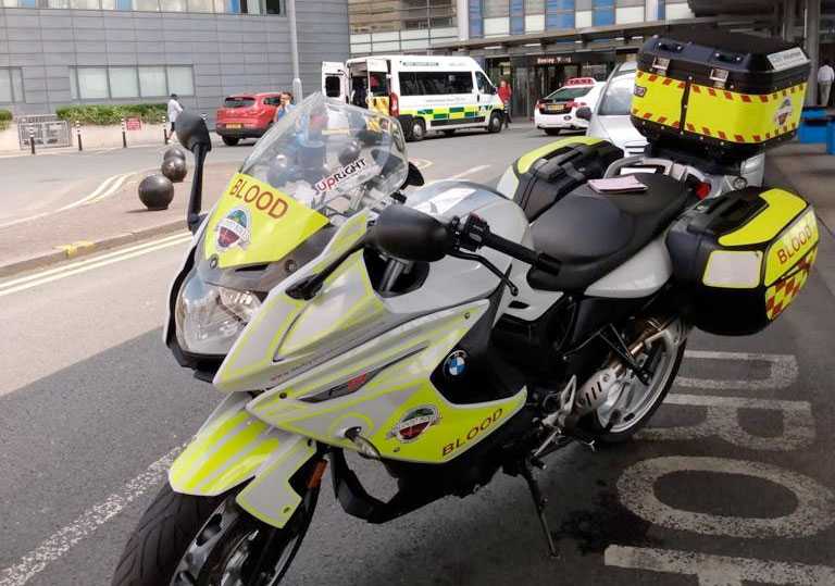 A derbyshire Blood Bike outside a hospital